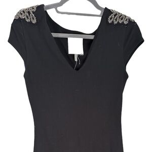 Tight black dress with detail on shoulder